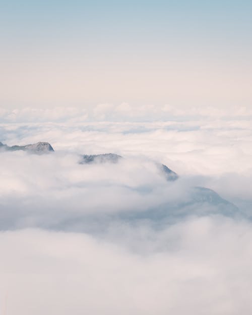 Aerial Photography of White Clouds over Mountains
