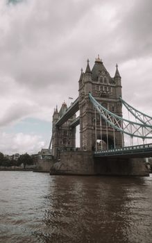Gloomy day view of Tower Bridge spanning the River Thames in London.
