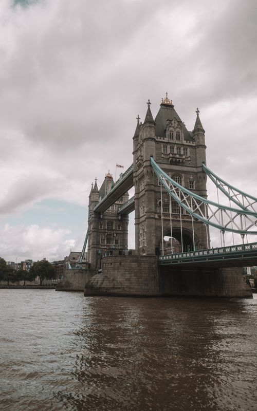 Free Gloomy day view of Tower Bridge spanning the River Thames in London. Stock Photo