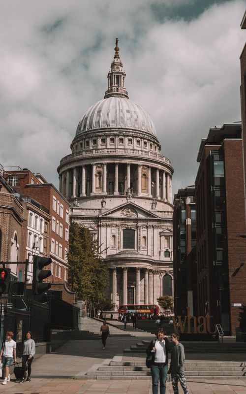 Free Explore the iconic St. Paul's Cathedral in London surrounded by city life. Stock Photo