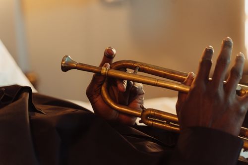 Free Artistic close-up of hands holding a brass trumpet, showcasing musical craftsmanship. Stock Photo