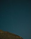 Brown Mountain Under Blue Sky during Night Time