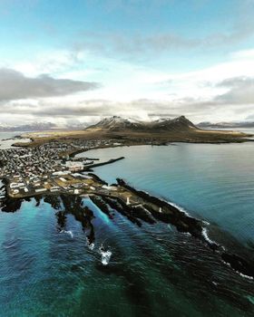 A stunning aerial view of Akranes, Iceland featuring coastal landscapes and mountains.