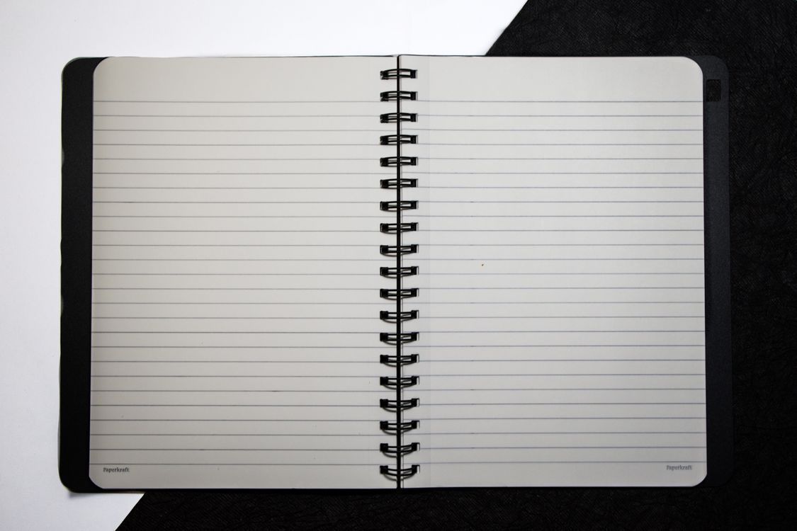 Close-Up Shot of an Open Notebook · Free Stock Photo