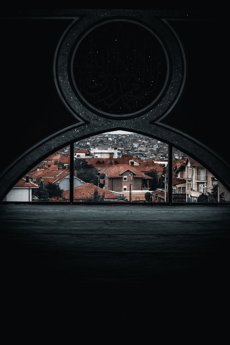 Black Empty Interior And Townscape Behind Round Window