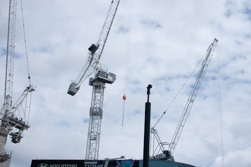 Gray Metal Crane Under Cloudy Sky