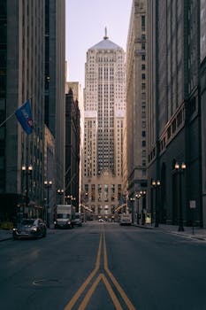 Looking down a city street towards a striking skyscraper, capturing urban architecture.
