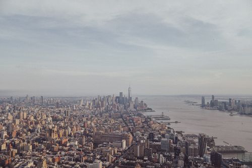 Free Stunning aerial view of New York City skyline with iconic One World Trade Center. Stock Photo