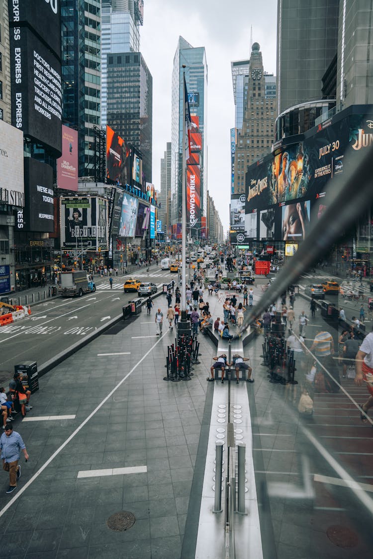 View Of Busy Downtown Street Reflected In Glass 