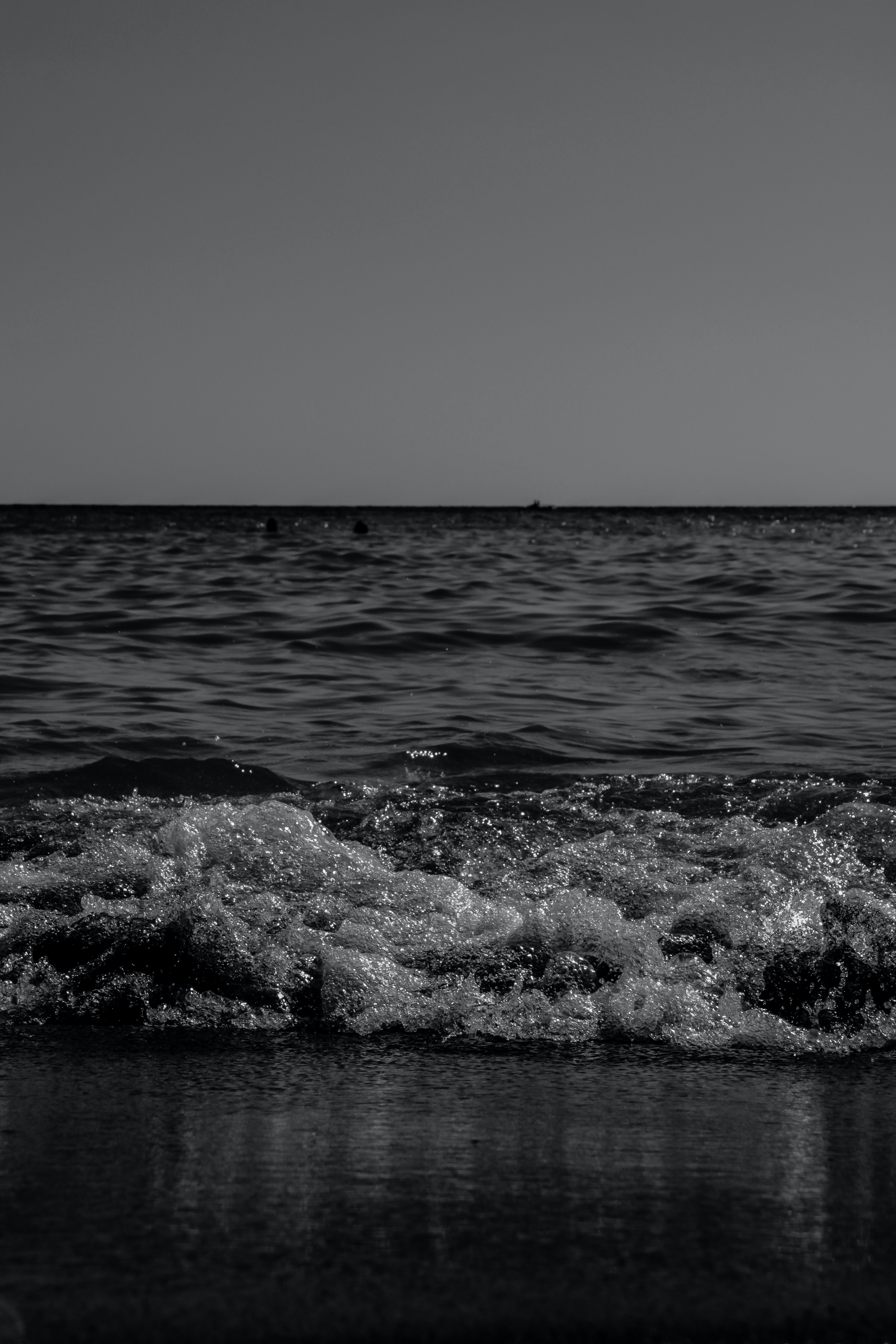 Black and White Ocean Waves at Sunset · Free Stock Photo