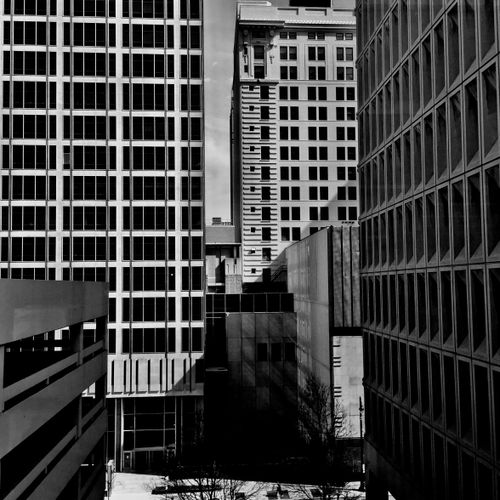 Free Black and white photograph capturing the high-rise buildings of downtown Kansas City, Missouri. Stock Photo