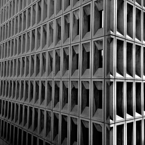 Geometric Facade of Building in Grayscale Photography