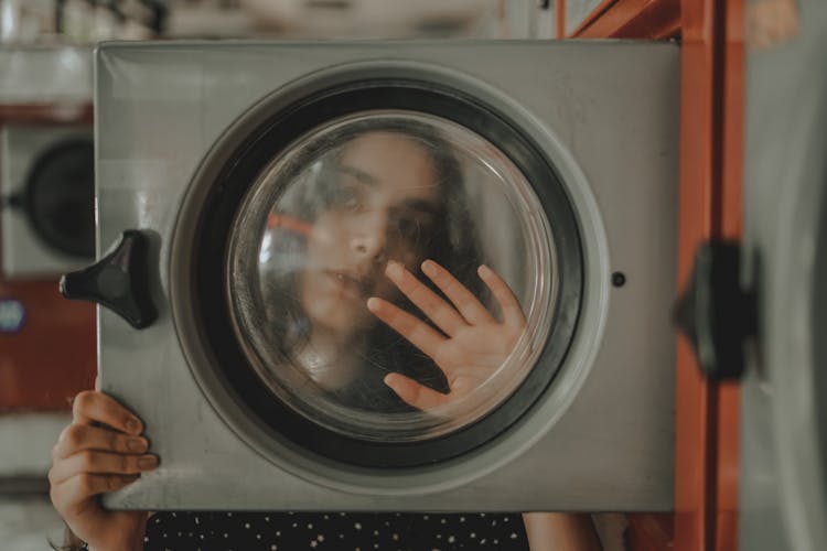 Woman Behind Microwaves Window