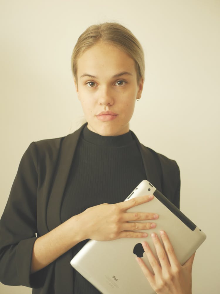 A Young Woman Holding Apple IPad