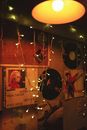 Wall with Posters and Vinyl Records Lit by Fairy Lights