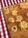 Fettuccine on the Wooden Cutting Board