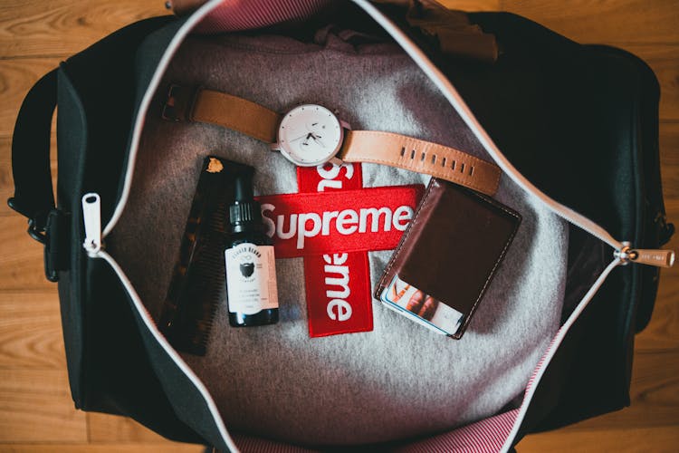 Watch, Flask, Wallet And Comb In Bag