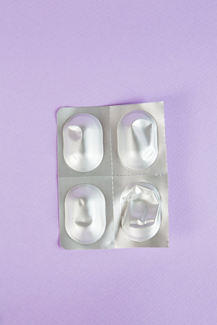 Medicine Packet On Purple Surface