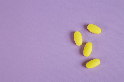 Yellow Tablets on Purple Surface