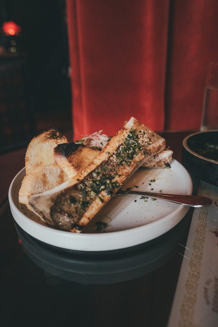 Toasted Bread With Bone Marrow On The Ceramic Plate