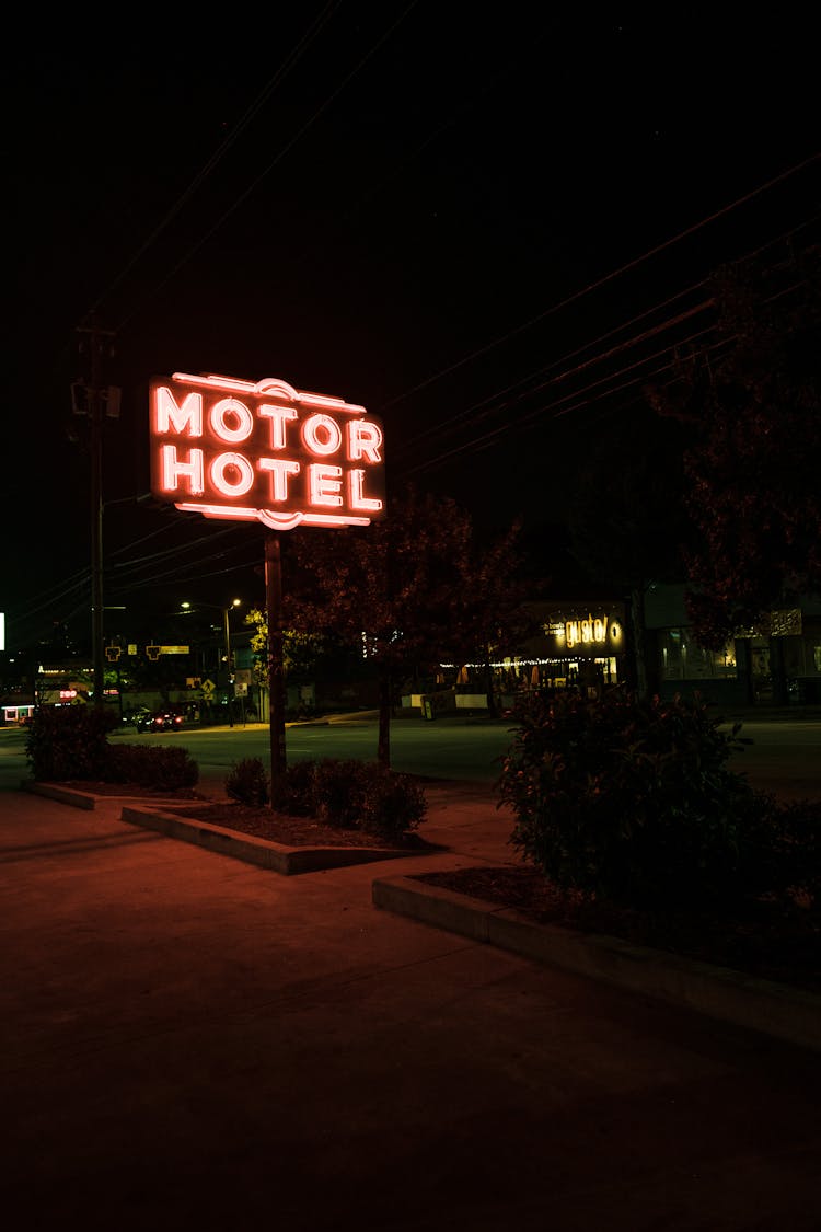 White And Red Neon Signage Of A Motor Hotel