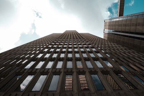 Free Stunning perspective of a high-rise building against a bright sky. Stock Photo