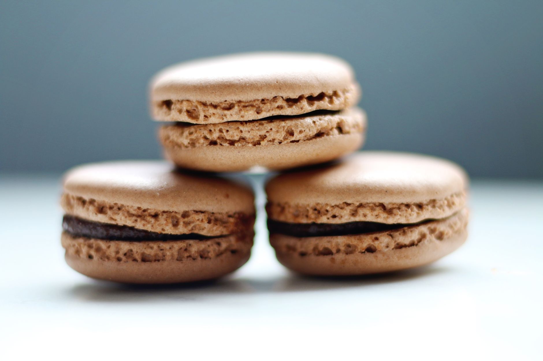 Chocolate macaron shells baking on tray