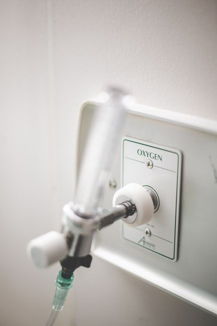 Photo by Stephen Andrews Close-up of a mounted medical oxygen supply outlet in a hospital setting.