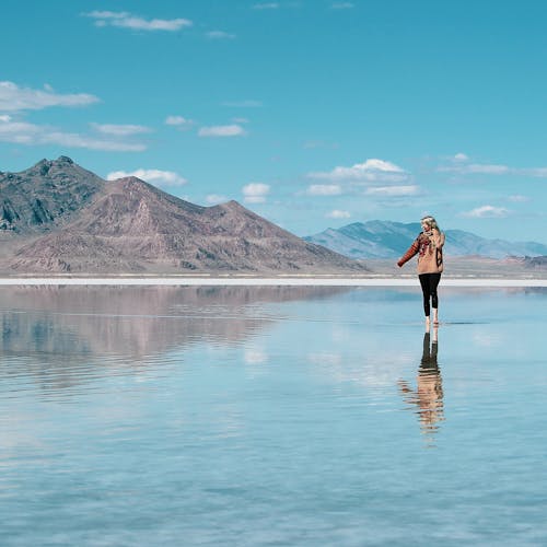 Free Woman Standing in Water Stock Photo