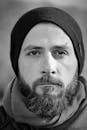 Portrait Photo of Man in Black Beanie