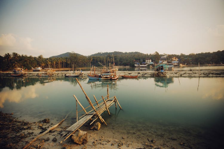 Wooden Boats In Water In Tropical Landscape