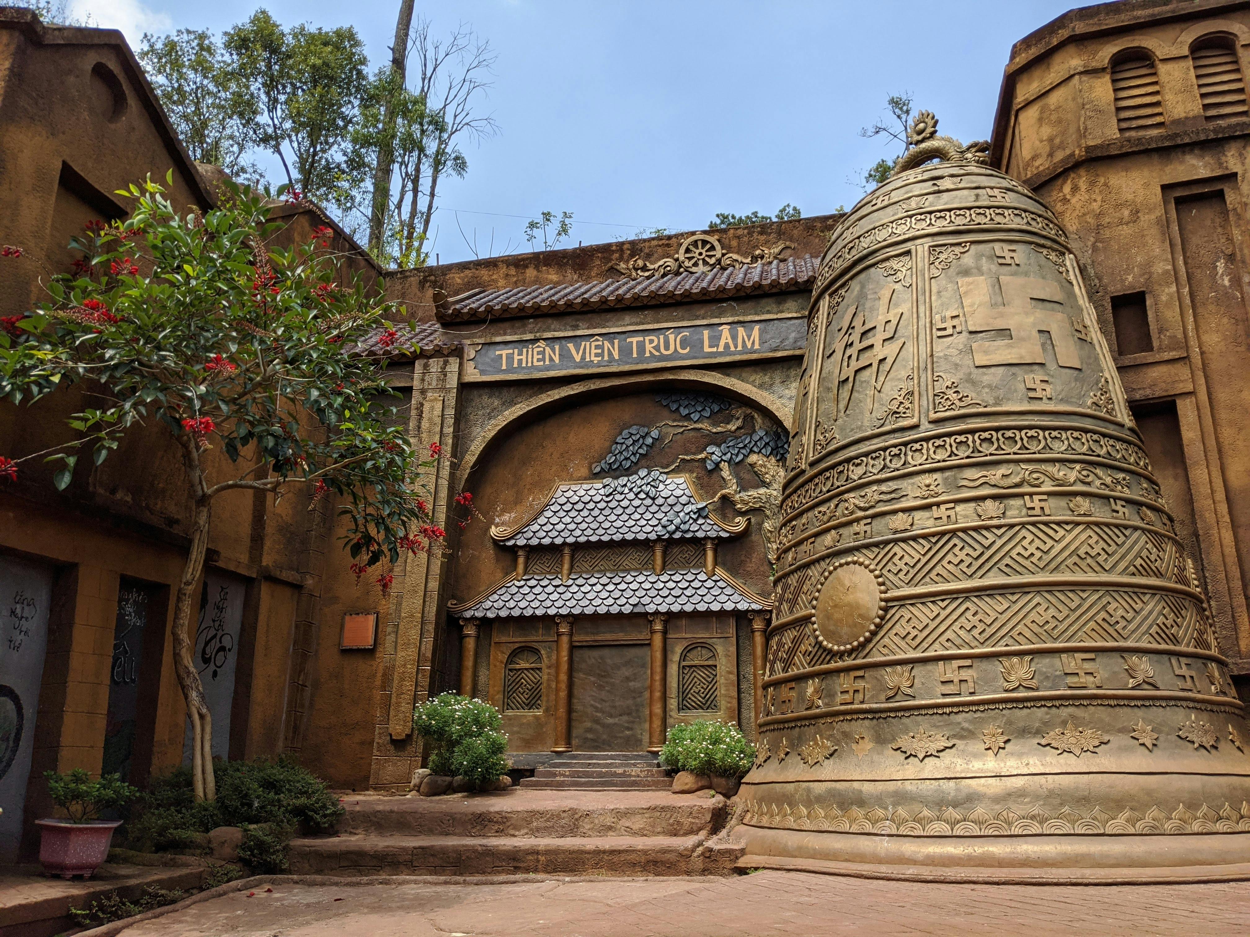 Intricate architecture and bell sculpture at Thien Vien Truc Lam, Dalat, Vietnam.