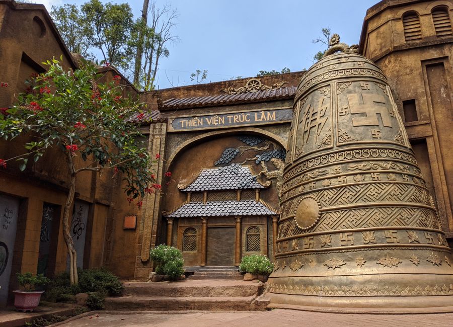 Intricate architecture and bell sculpture at Thien Vien Truc Lam, Dalat, Vietnam.
