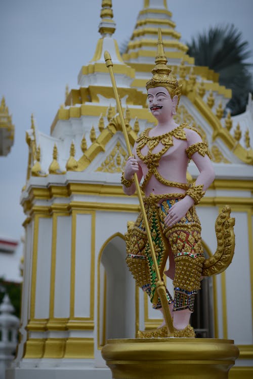 Free Golden Statue Near the Temple Stock Photo