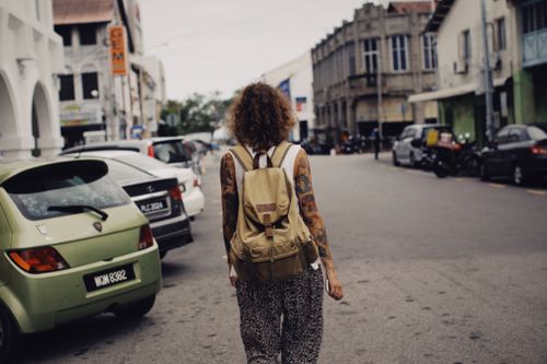 Street walk with a rucksack — photo by Alexey Demidov on Pexels