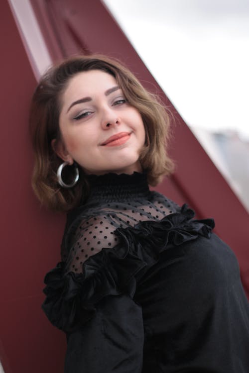 A Woman in Black Long Sleeve Dress