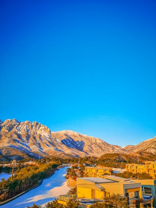 Free stock photo of blue sky, mountains view, residential area