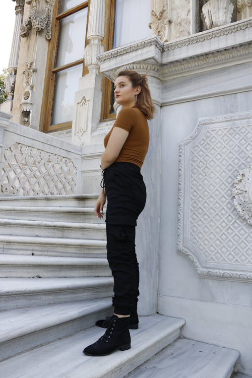 Woman in Brown Top and Black Pants 