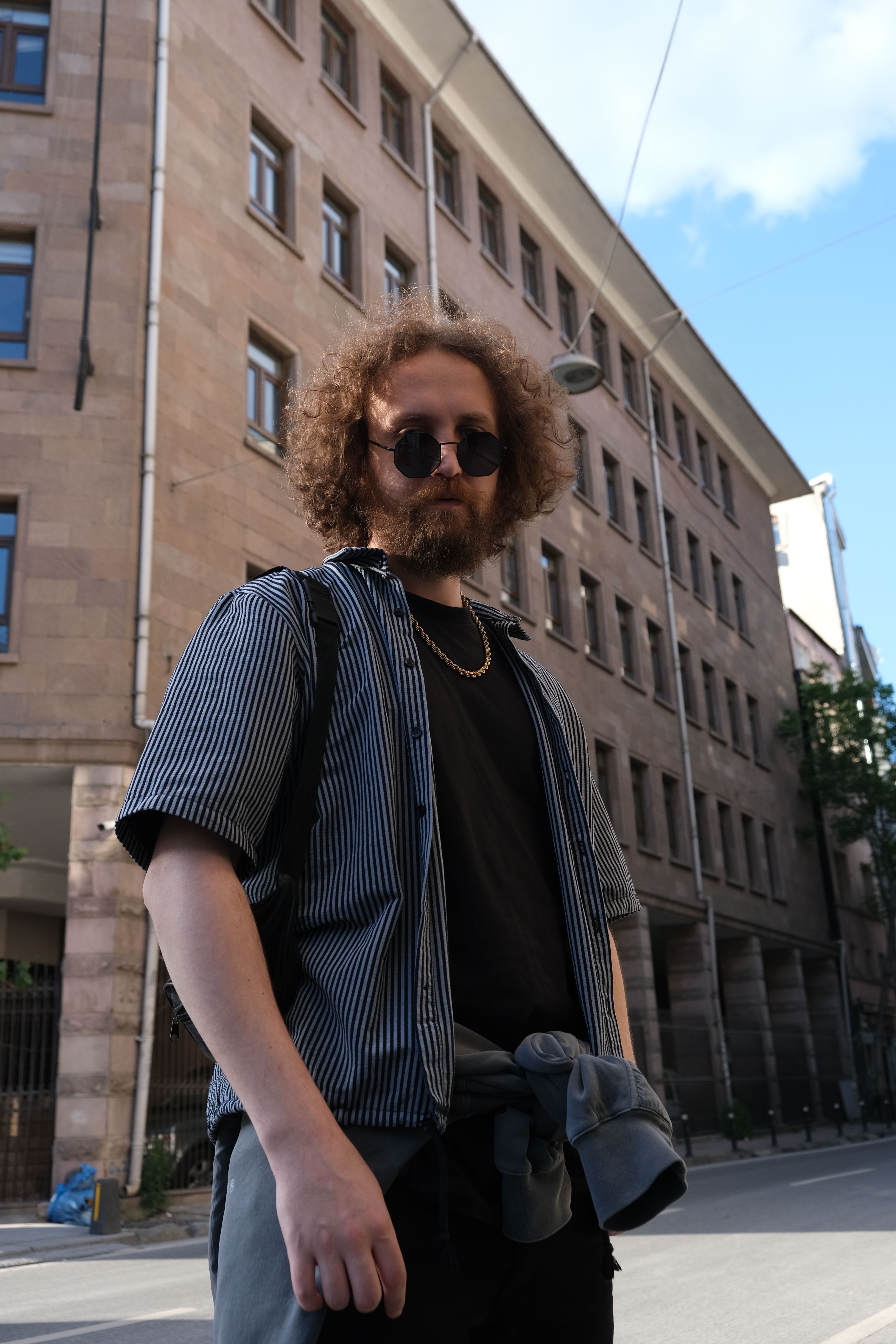 Man Wearing Black Sunglasses Standing in Front of a Building · Free ...