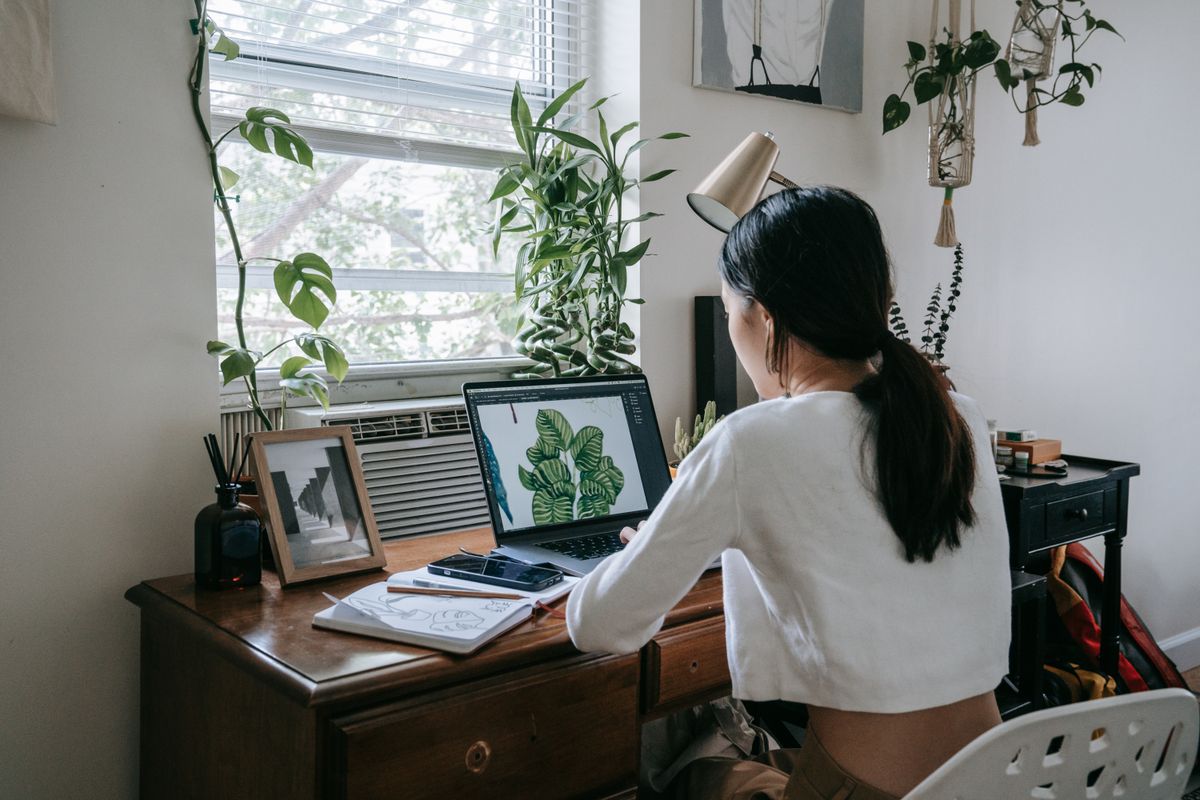 Someone working from a plant-filled room at home - photo by Sasha Kim on Pexels