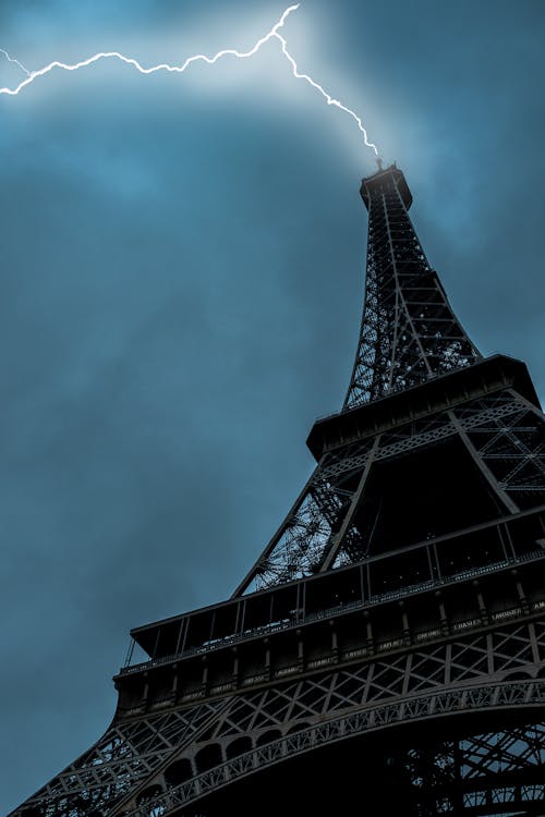 Low-angle Photo of Eiffel Tower Struck by Lightning