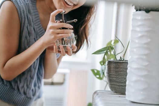 A Happy Person Holding a Spray Bottle