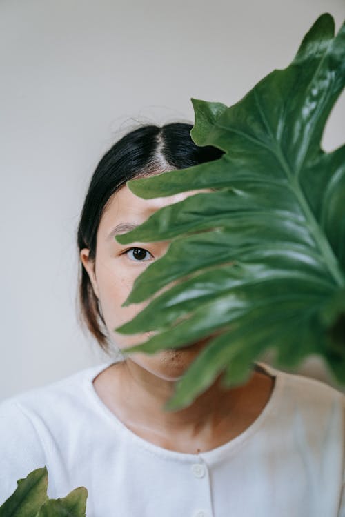 Woman Face Covered with Leaf