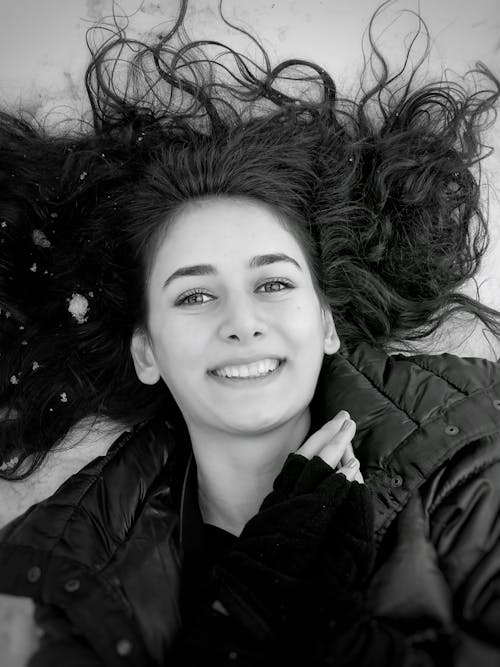 Monochrome Photo of Pretty Woman Smiling