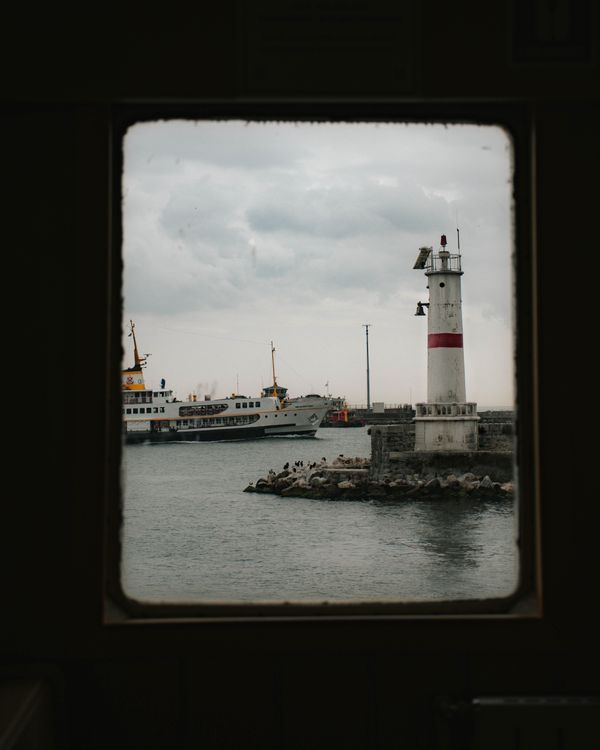 View Lighthouse Window A Lighthouse Viewed from a Glass Window · Free Stock Photo
