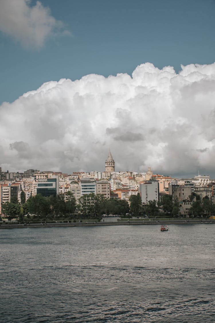 Waterfront City On Blue Sky Background