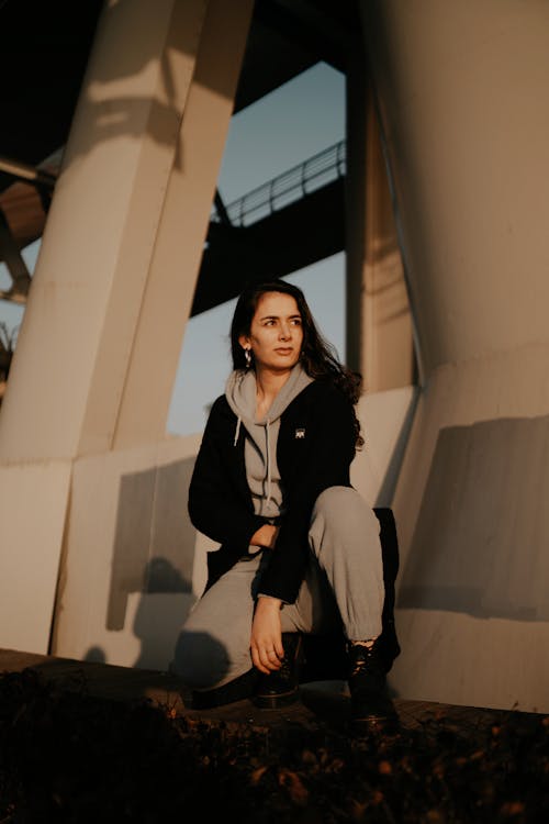 Stylish Woman in Gray Hoodie and Black Jacket 