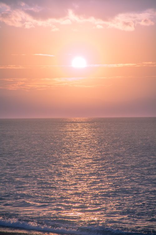 Free Breathtaking sunset view over calm ocean waters in West Nusa Tenggara, Indonesia. Stock Photo