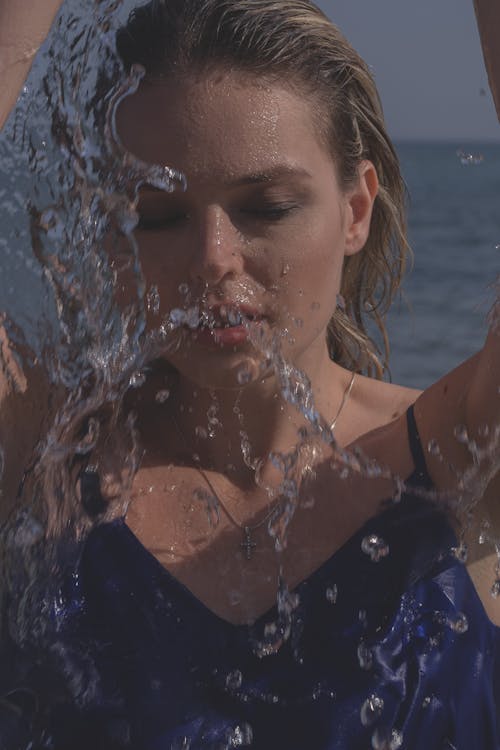 A Woman Splashing in the Beach