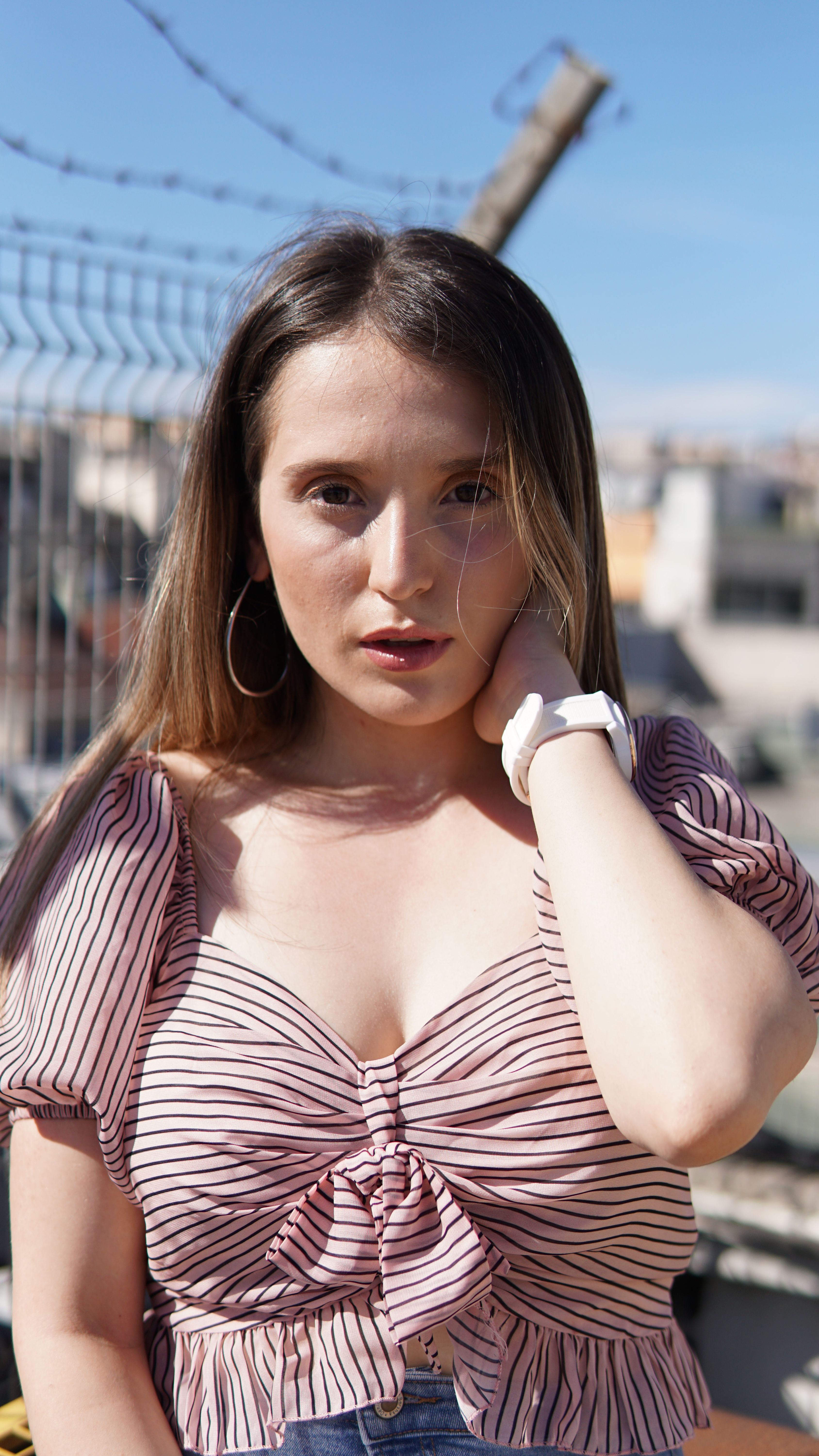 Woman in Striped Blouse Posing · Free Stock Photo